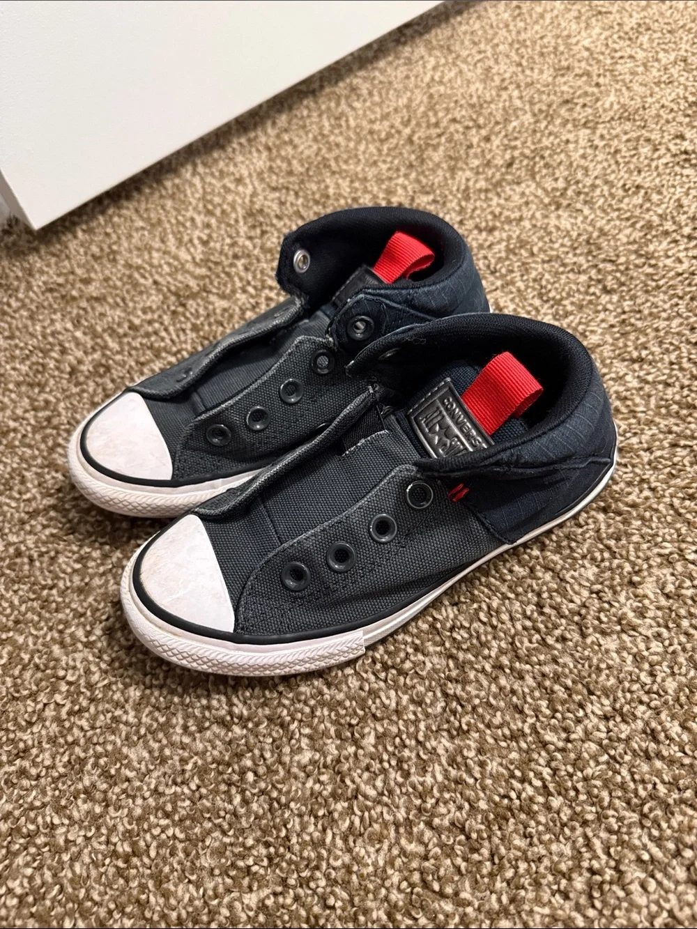 Converse Kids Black Canvas Slip-On Sneakers with Red Heel Loop